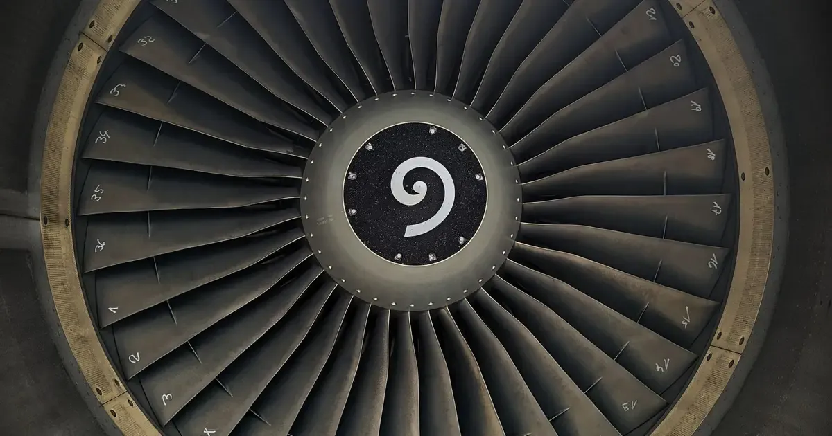 Front view of a jet engine with a ring of fan blades around the hub, a generic photo of the engine class that uses Waspaloy and Rene 41 parts in its hot sections